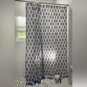 John Robshaw white and blue shower curtain with tassles. Spectacular.